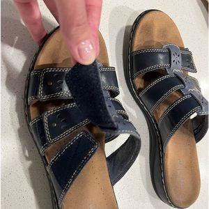 Woman’s slip on leather sandals.